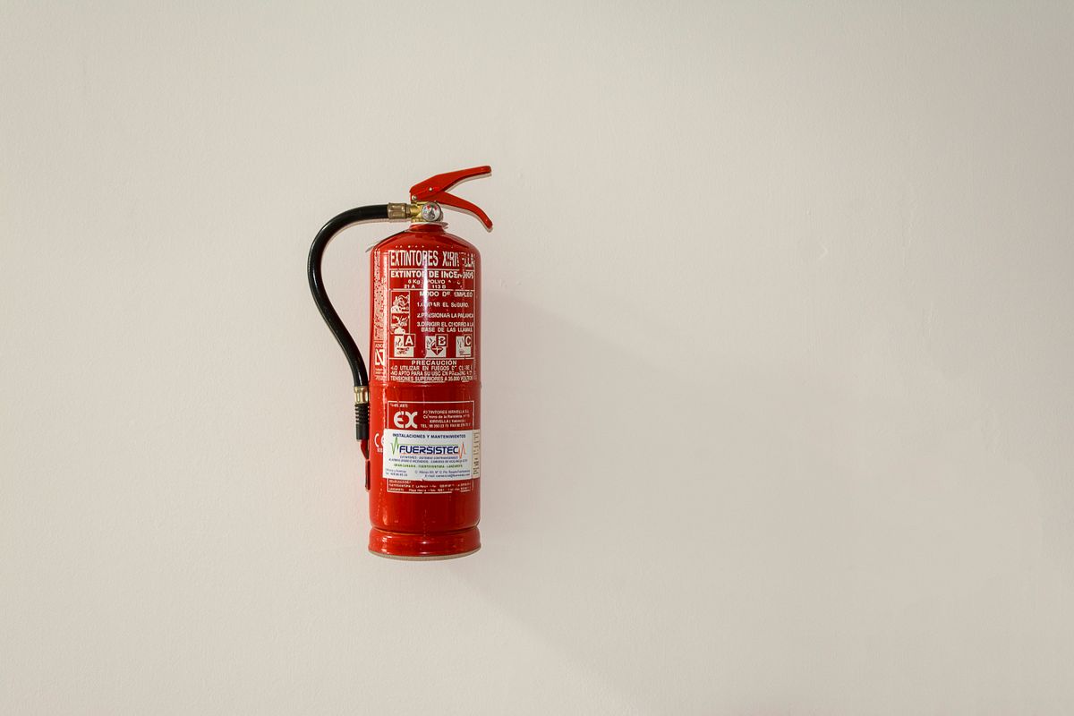 Wall-mounted fire extinguisher